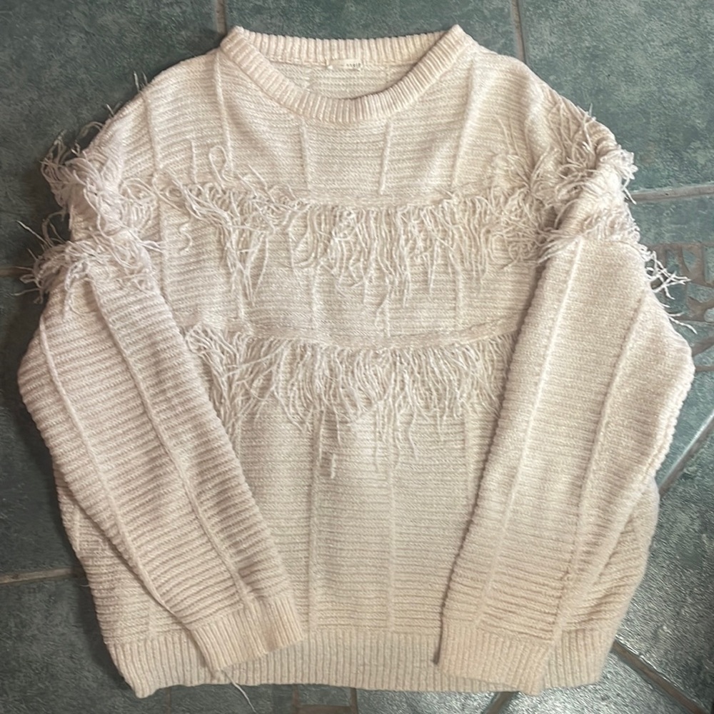 Cream fringe sweater.